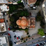 A dynamic aerial shot of the Rotunda Church in Thessaloniki, Greece, showcasing its architectural beauty.